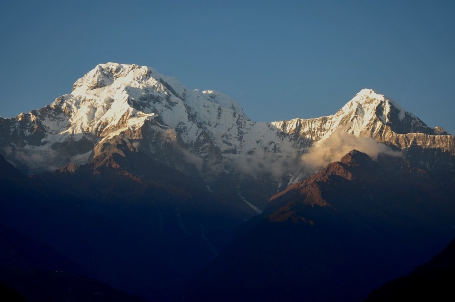Snow-Capped Mountain Peaks with Sunlight